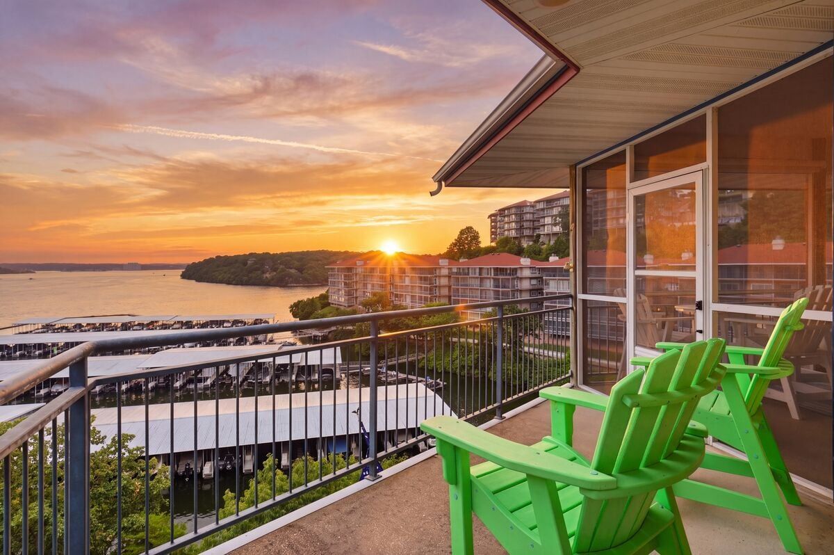 Private balcony with breathtaking main channel views and unforgettable Lake of the Ozarks sunsets.